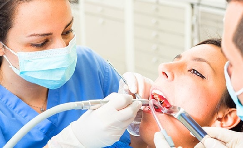 Professional dental assistant in office